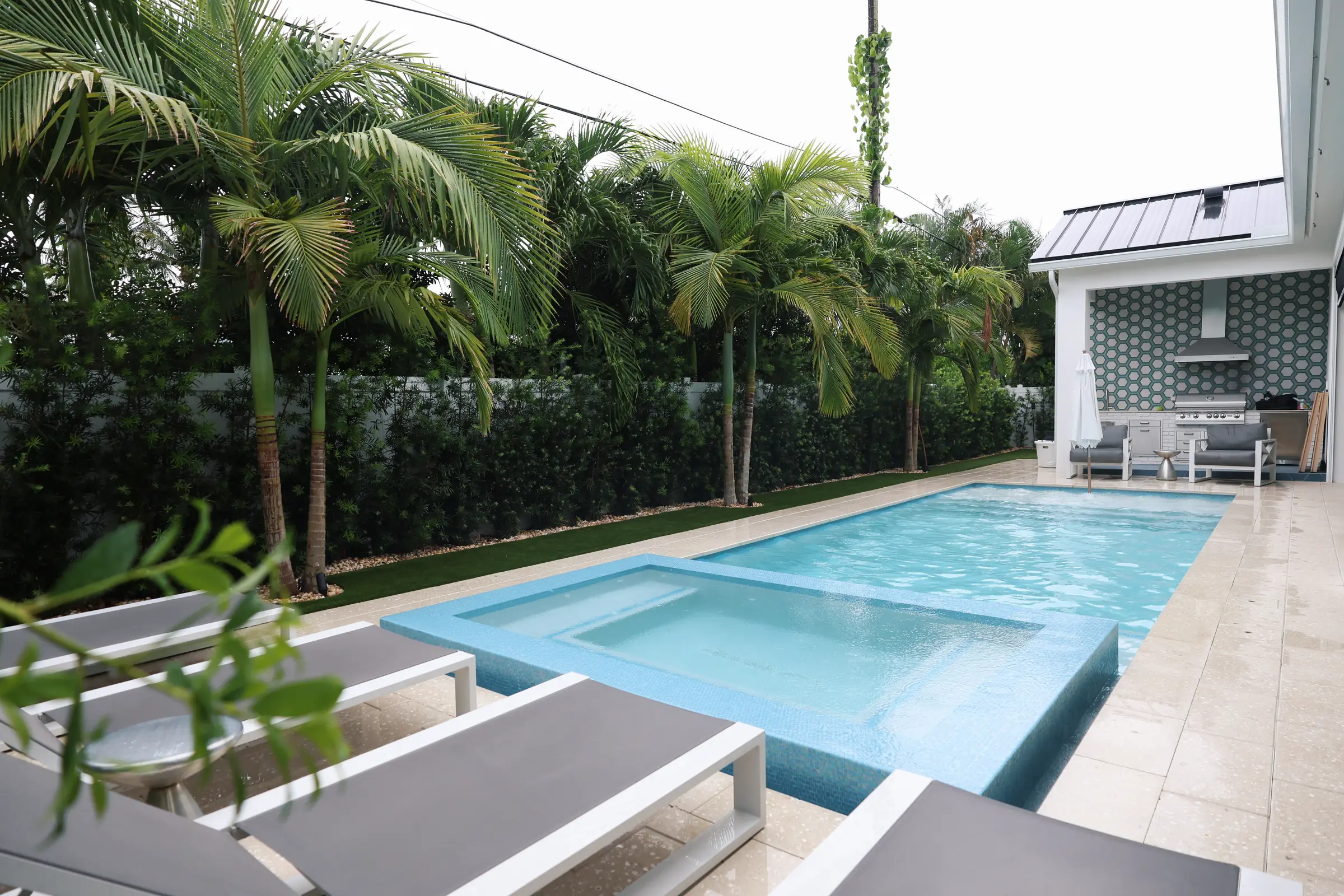 Spa and pool through foliage