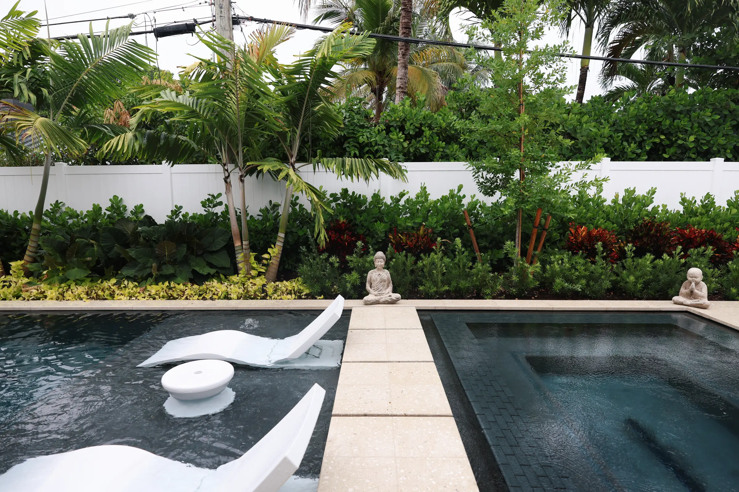 Buddha statues and in-water loungers