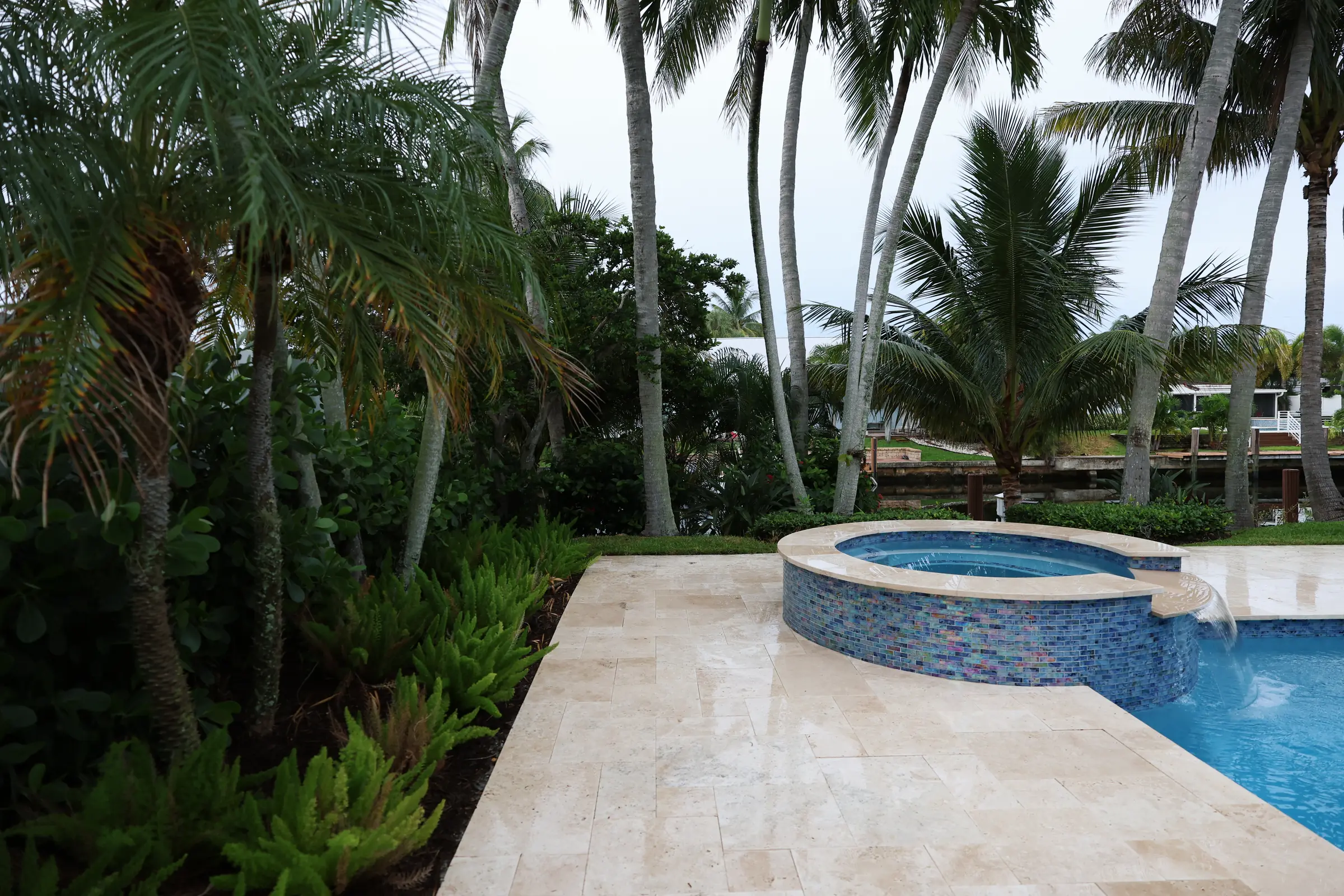 Spa and pool under palm fronds